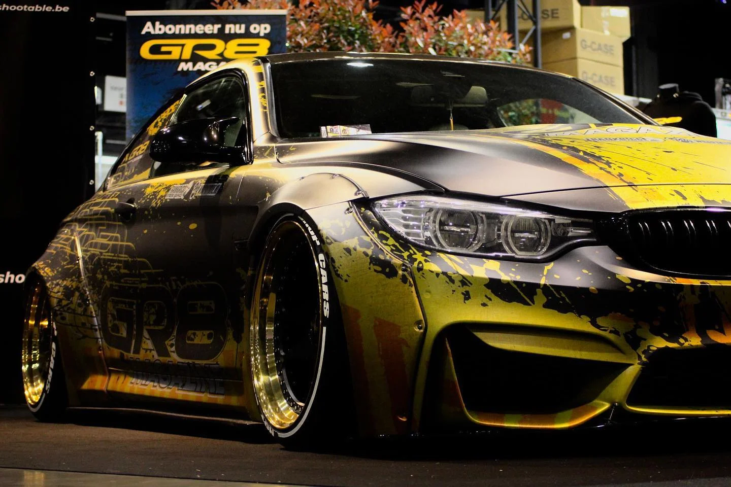 BMW M4 Liberty Walk — GR8 Magazine wrap design by Frank Ricci Design — front quarter warm light